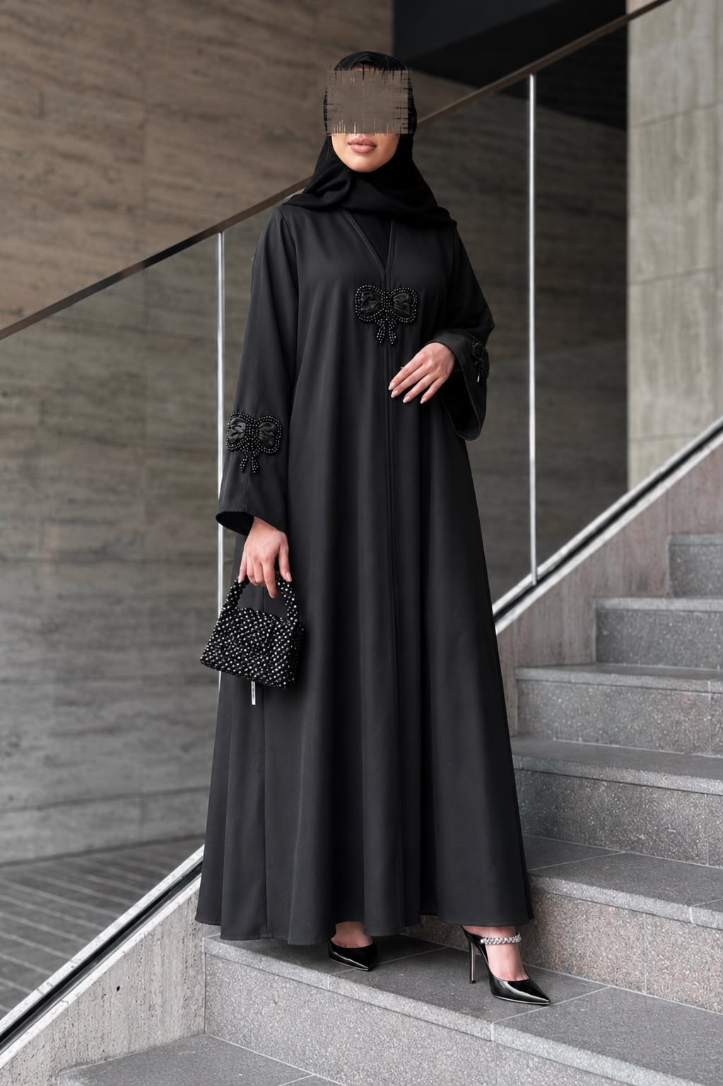 Full-length view of the black Layl Bow Abaya