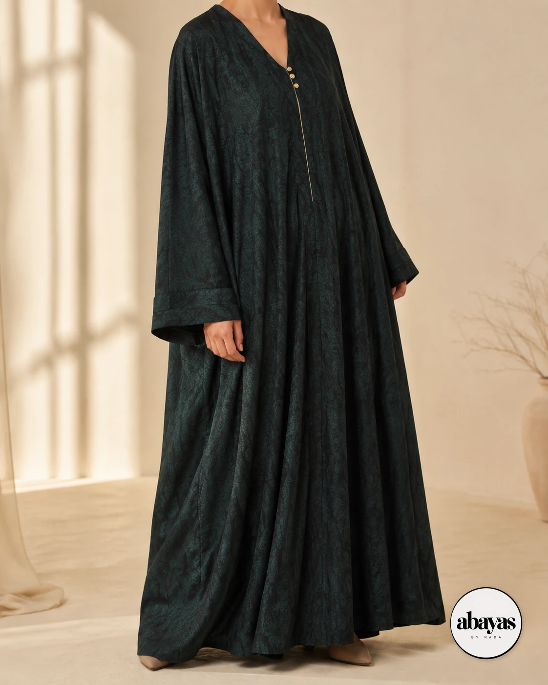 Three-quarter front view of the deep green Cypress Print Abaya