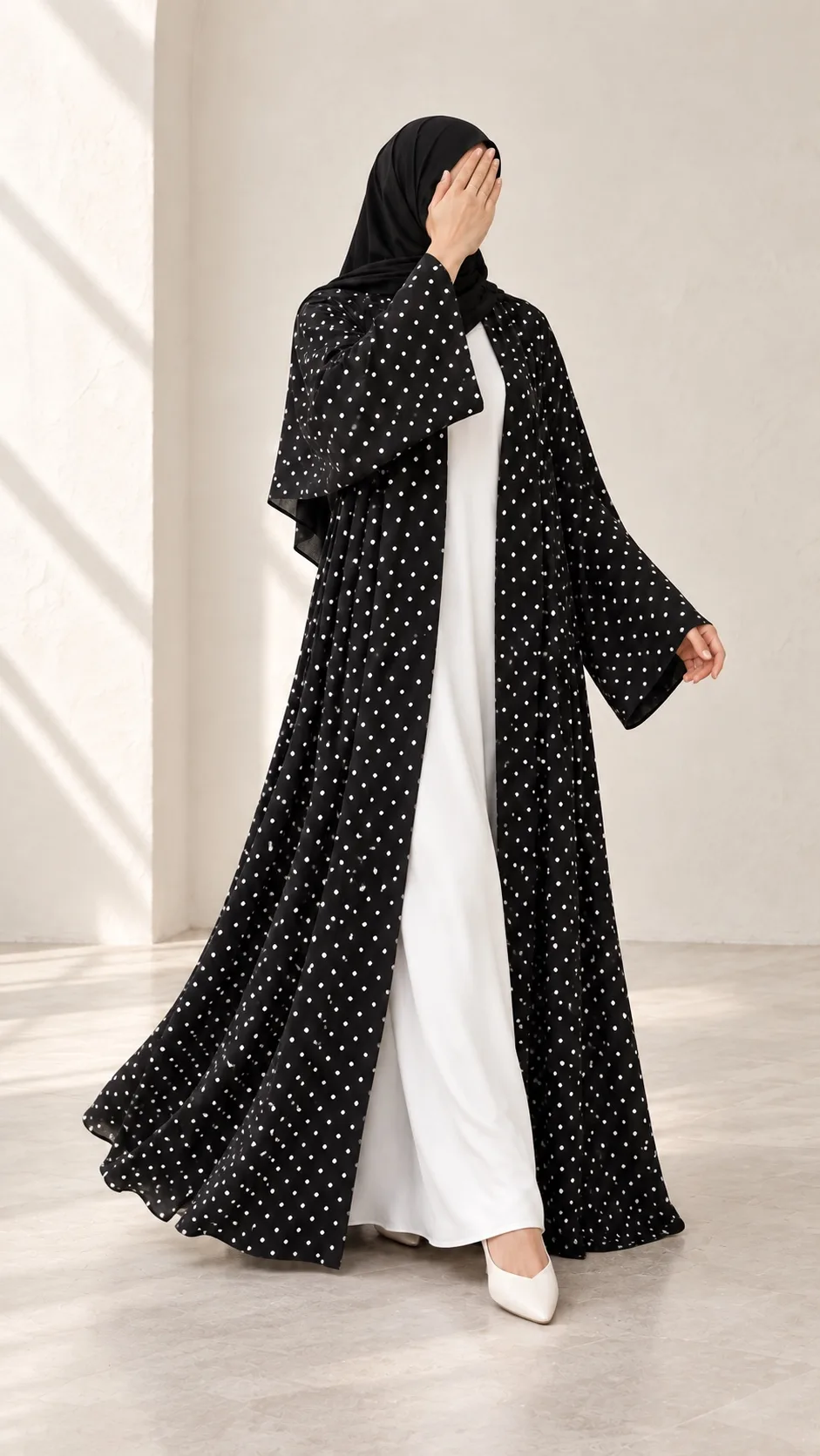 Black Dot Abaya shown while walking