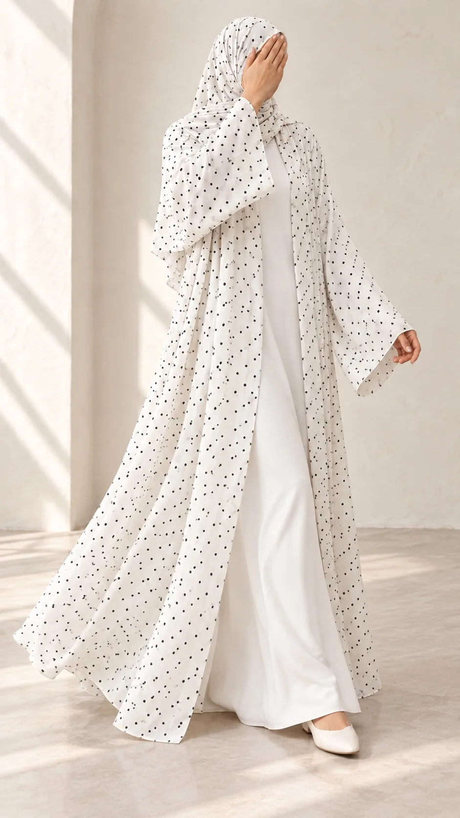 White Dot Abaya shown while walking