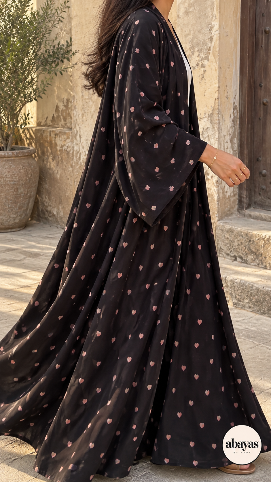 Heart Emoji Abaya side view in black with pink hearts